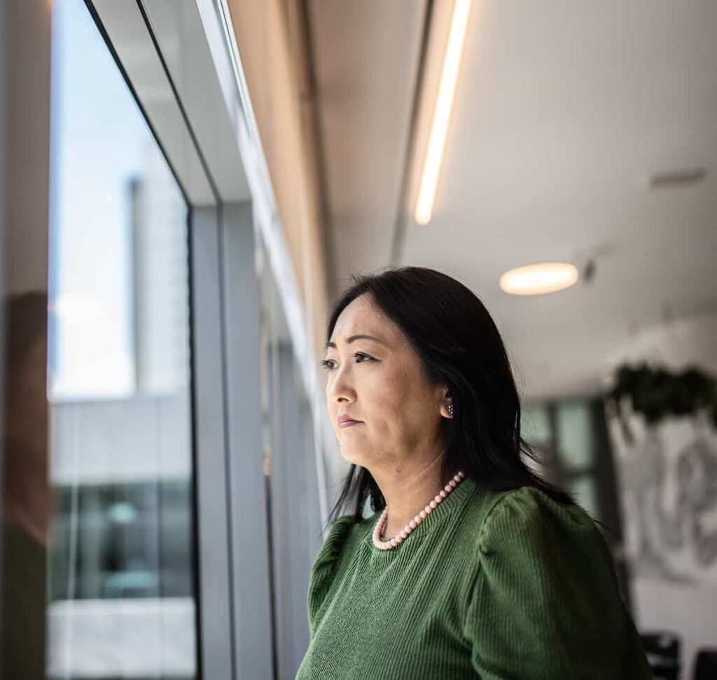 woman staring out window