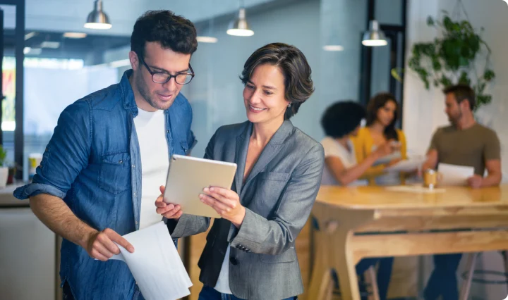 coworkers working on tablet