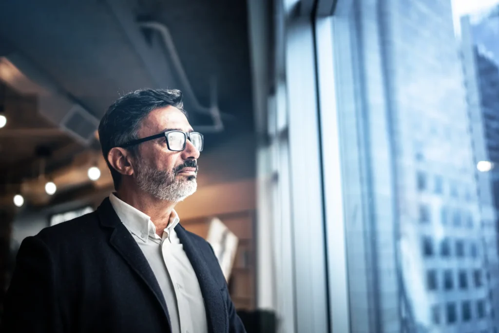 businessman gazing out window
