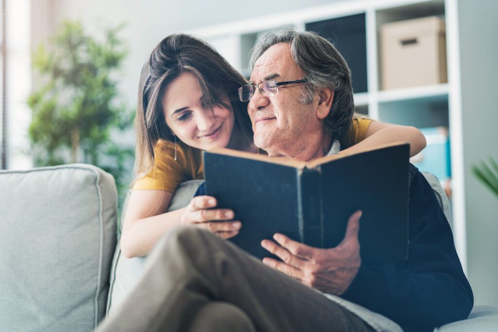 grandfather granddaughter reading together