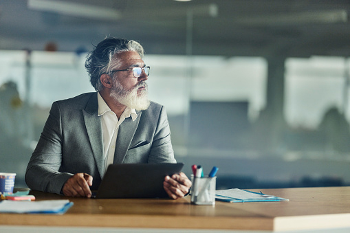 man reviewing documents at desk