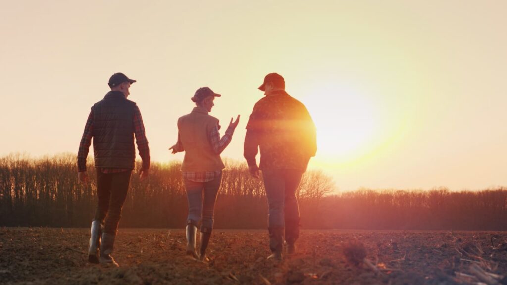 family walking into sunset